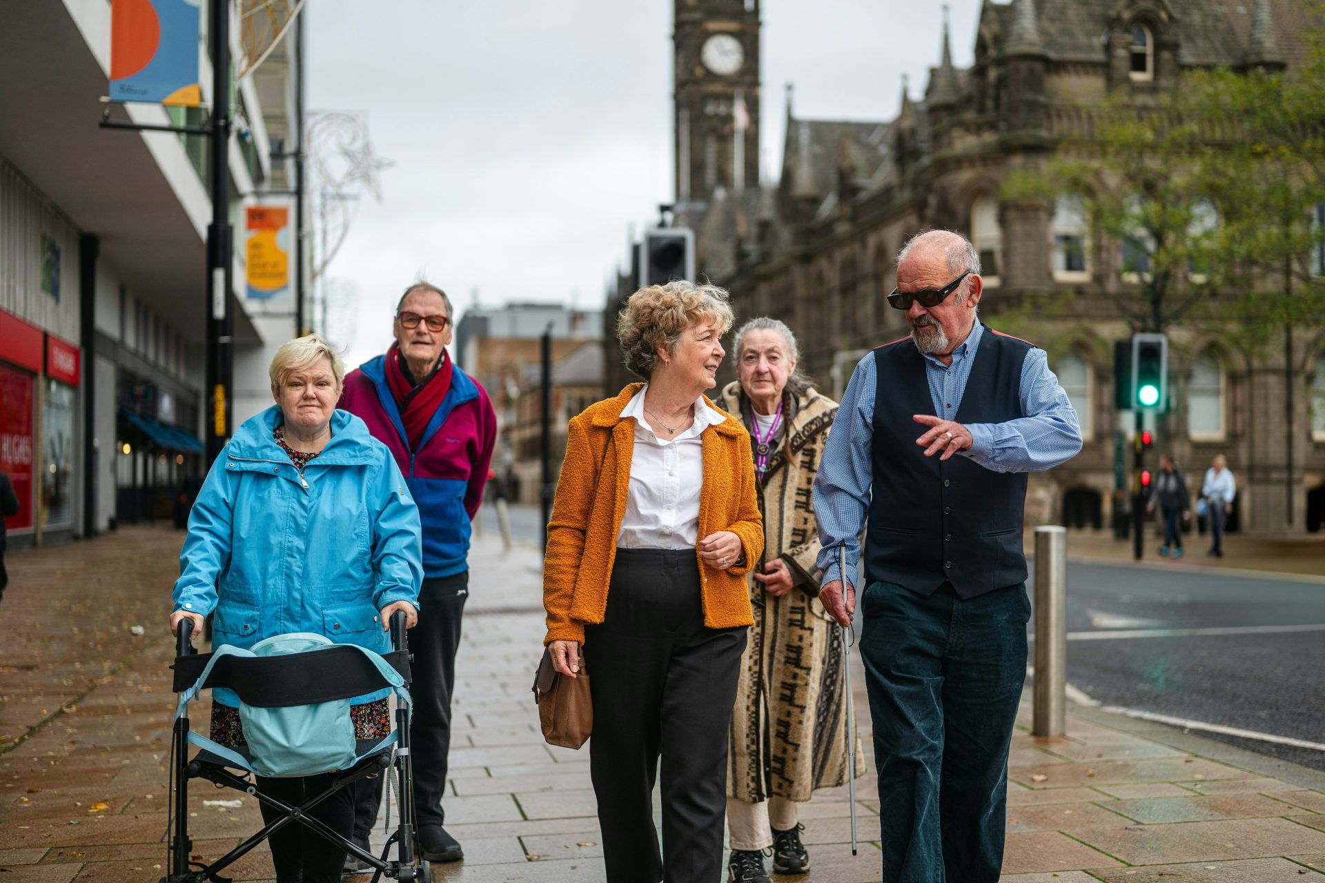 Group of seniors walking down a city street.